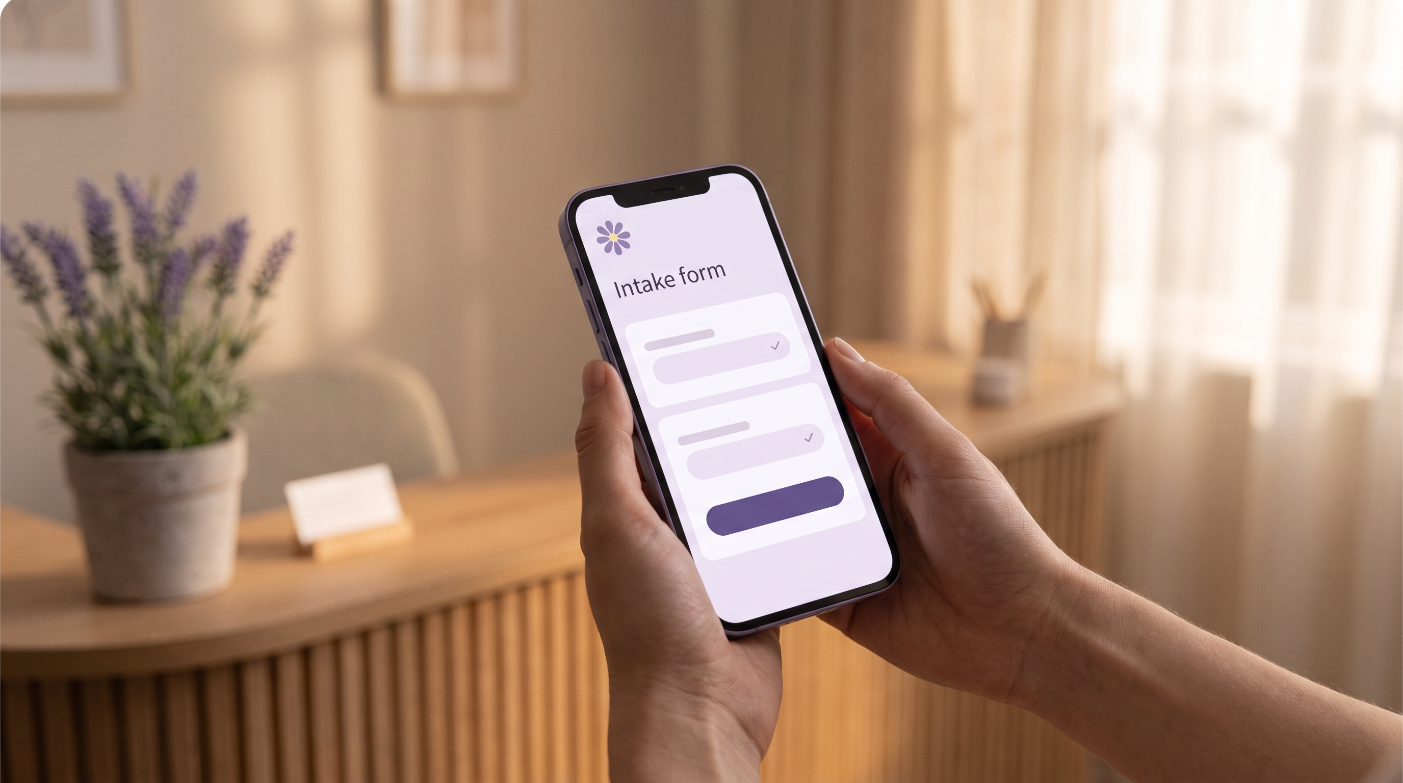 A patient's hands holding a phone showing a short, tidy lavender intake form in a calm clinic reception